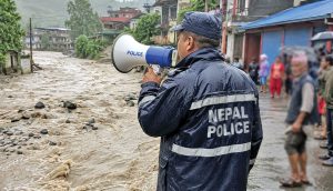 Police Saving Citizens Themselves Swept Away in Flood